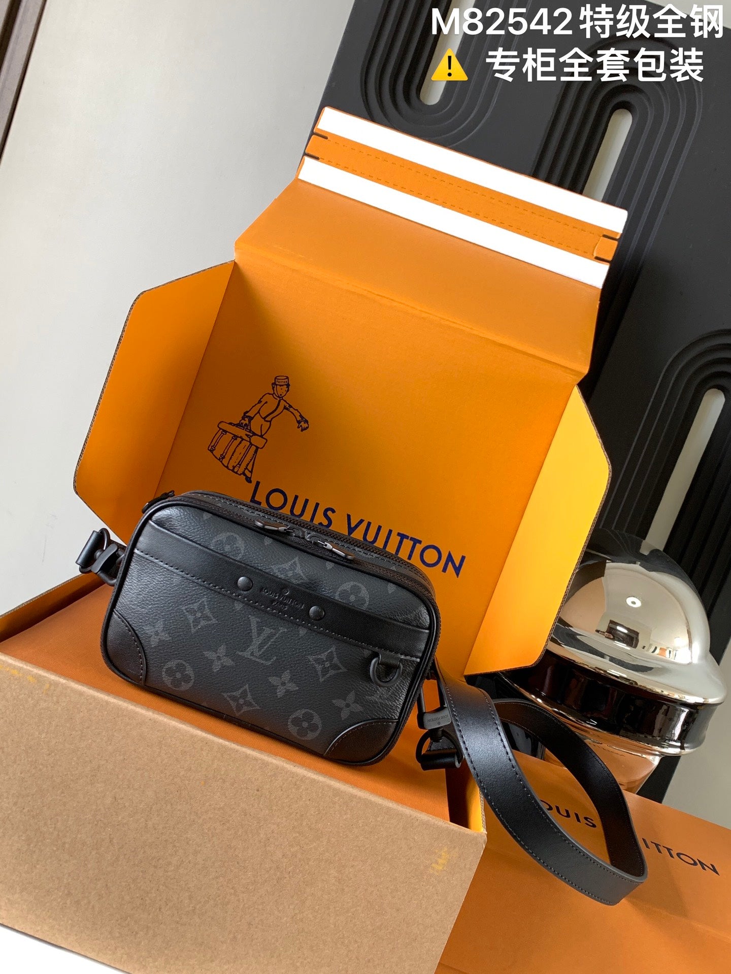 Louis Vuitton crossbody bag with monogram canvas, dark gray leather strap, zip front