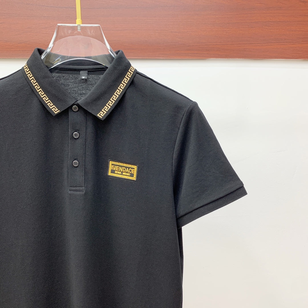 Versace black polo shirt with gold-trim collar and chest logo patch