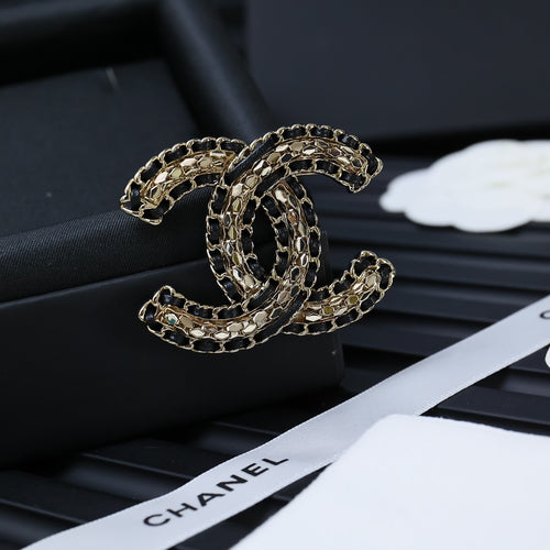 Chanel link chain accessory with interlocking ovals, gold-tone and dark details