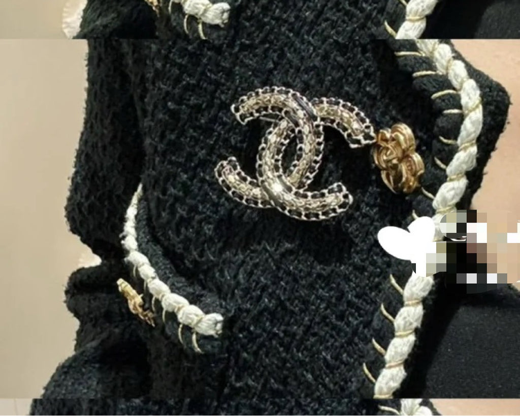 Chanel chain accessory with braided cord and oval logo charm, gold-tone