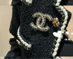 Chanel chain accessory with braided cord and oval logo charm, gold-tone