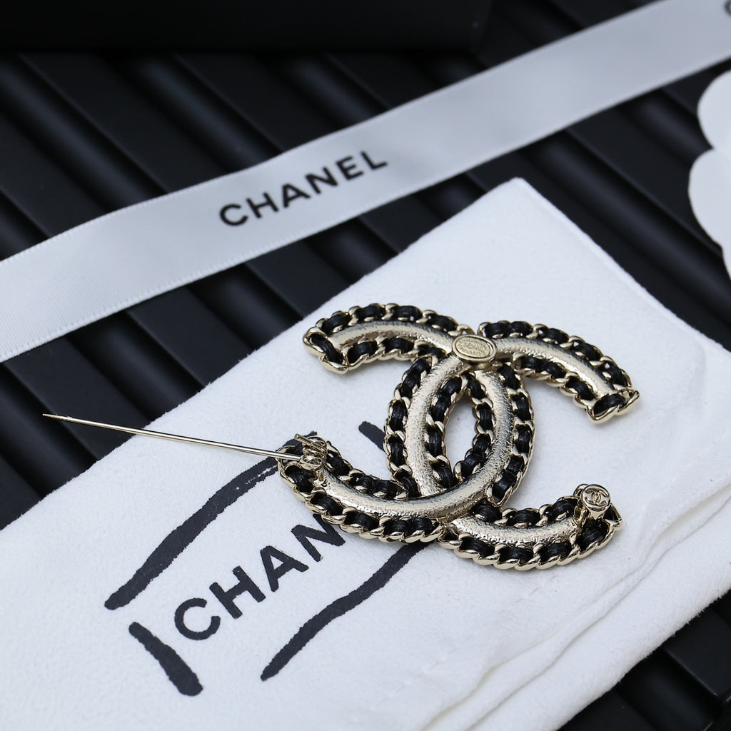 Chanel link chain bracelet with oval links and clasp on white card