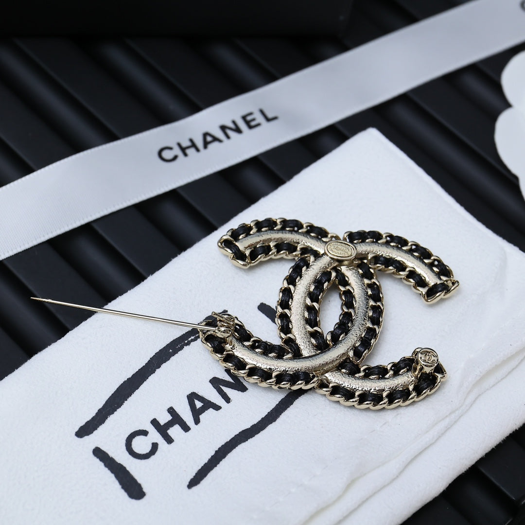 Chanel link chain bracelet with oval links and clasp on white card
