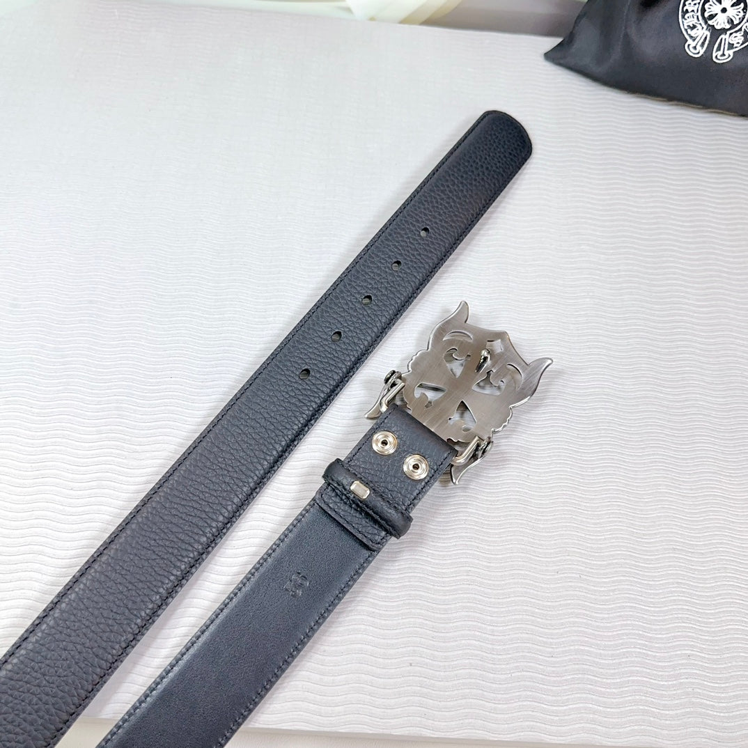 Dark leather belt end with silver-tone buckle hardware and adjustment holes