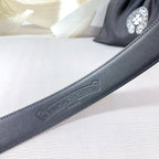 Dark leather belt strap with embossed logo and neat stitched edge