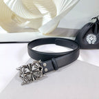 Dark leather belt with ornate silver-tone buckle and belt holes
