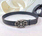 Dark faux-leather belt with ornate silver buckle and multiple adjustment holes