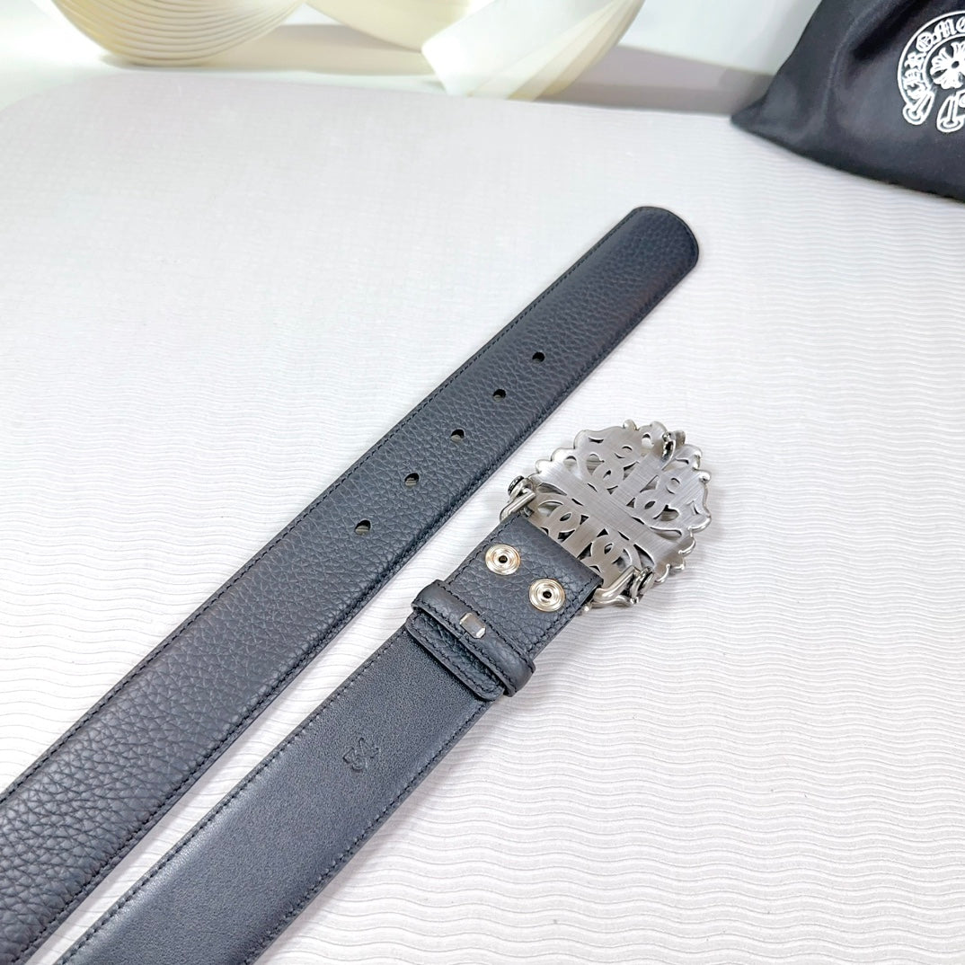 Dark faux-leather belt with silver buckle and stitched keeper detail over holes