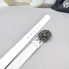 White leather belt with silver-tone buckle and adjustment holes visible