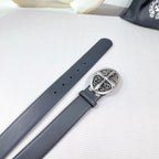 Dark gray leather belt strap with ornate chrome buckle and engraved plate
