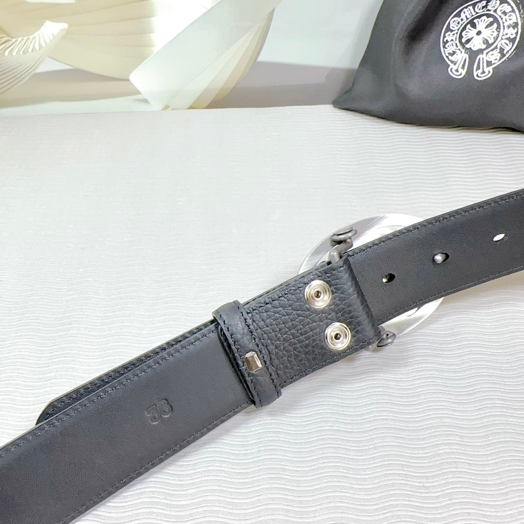 Dark gray leather belt with riveted buckle strap and metal grommets