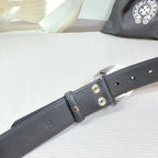 Dark gray leather belt with riveted buckle strap and metal grommets