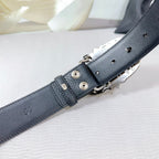 Chrome belt adjustment end: dark leather strap with metal clasp and hole section.