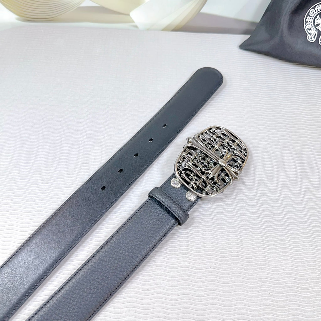 Chrome belt detail: dark leather strap with multiple holes and chrome buckle.