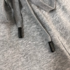 Heather gray shorts with black label tags near the hem, MONCLER