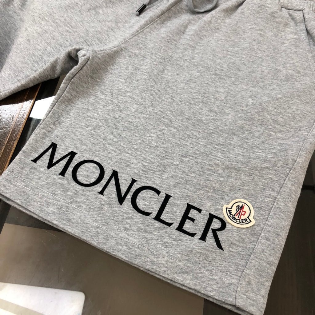 Heather gray shorts with large MONCLER lettering and small crest logo