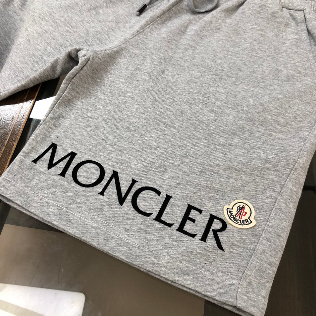 Heather gray shorts with large MONCLER lettering and small crest logo