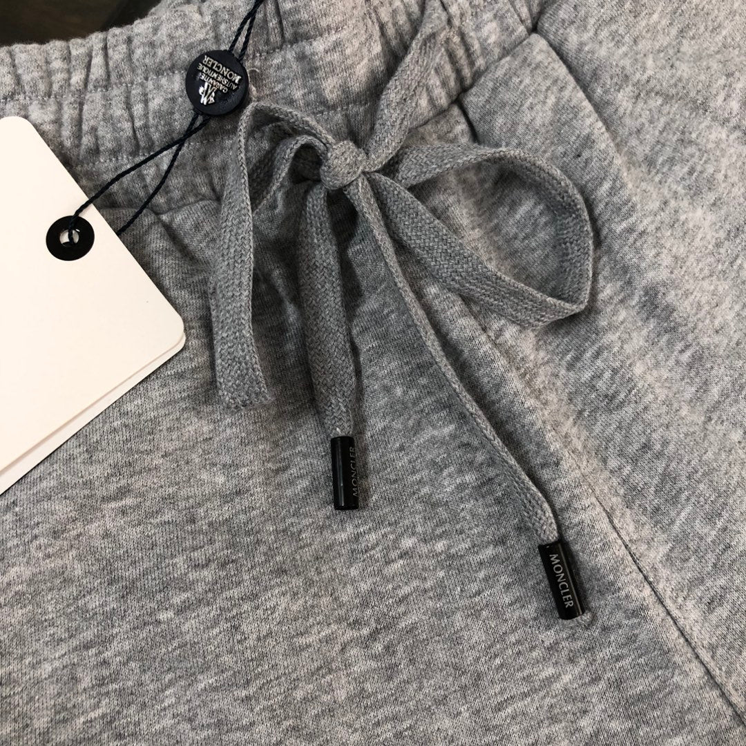 Heather gray shorts with drawstring waist and black MONCLER label tabs