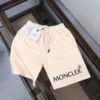 Cream drawstring shorts with MONCLER logo patch and black drawcord
