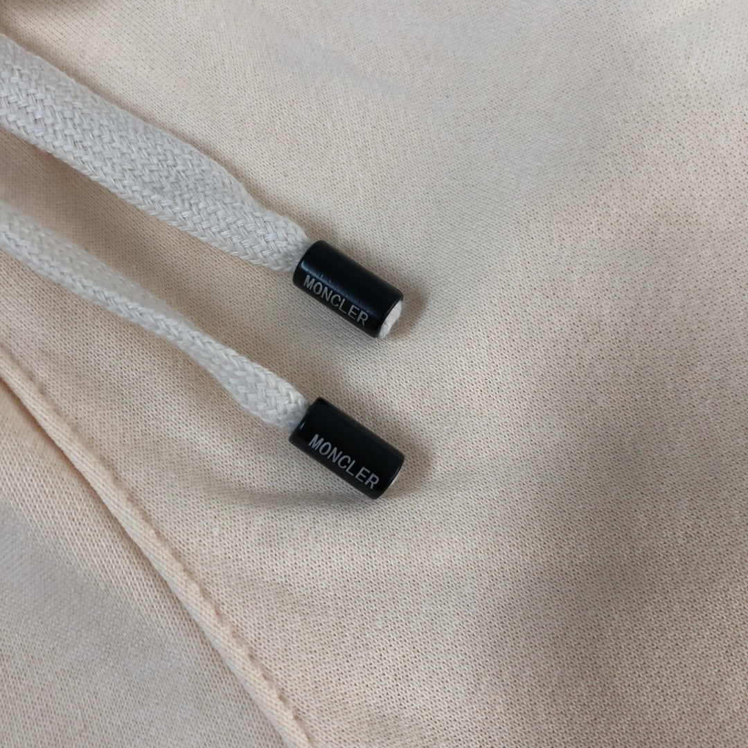 Cream shorts drawcord ends with MONCLER labels