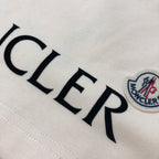 Light fabric embroidered MONCLER lettering with crest patch