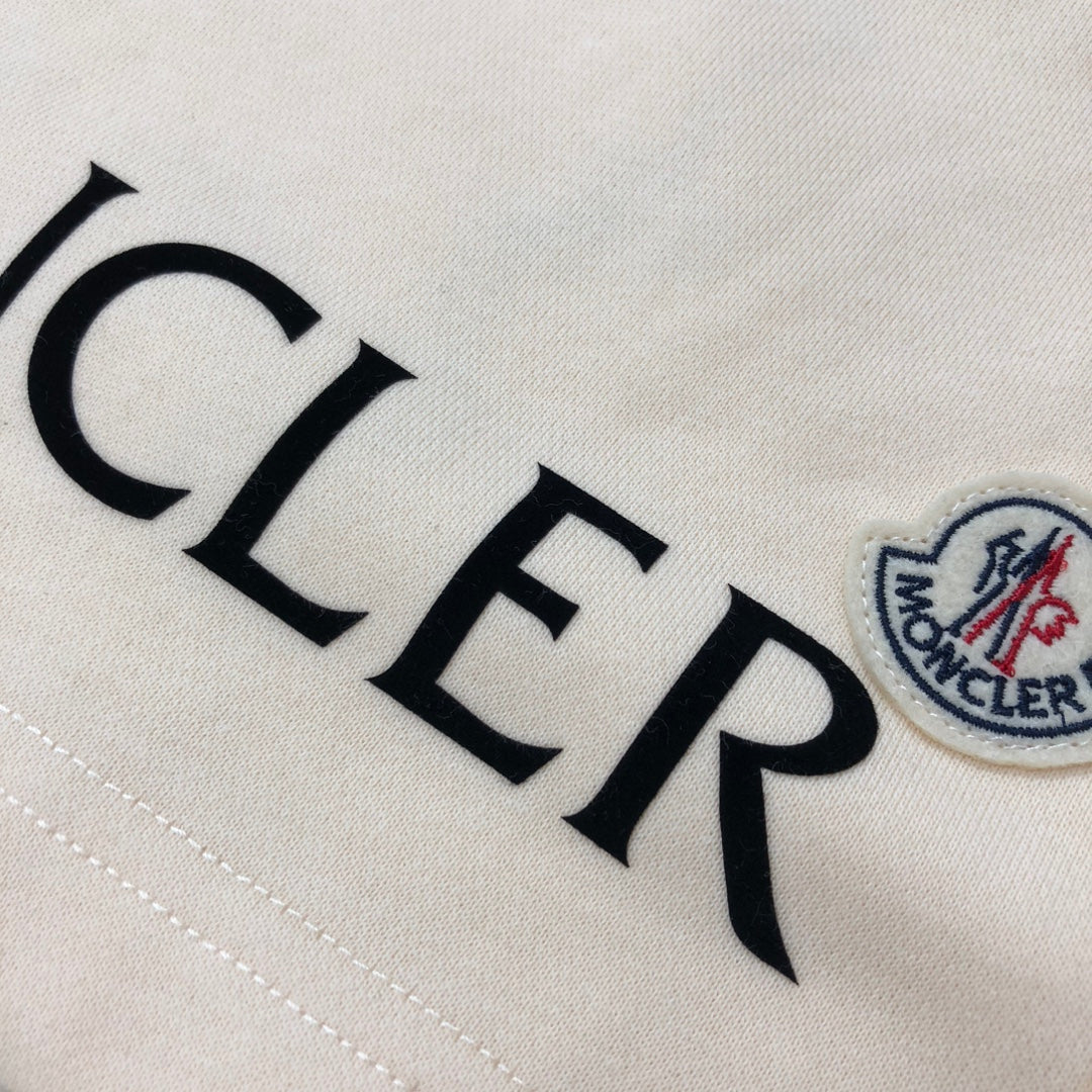 Light fabric embroidered MONCLER lettering with crest patch