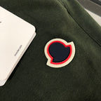 Heart-shaped patch applique with red outline on dark green shorts