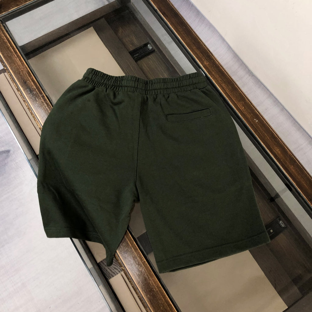 Dark green shorts with elastic waistband and side pockets