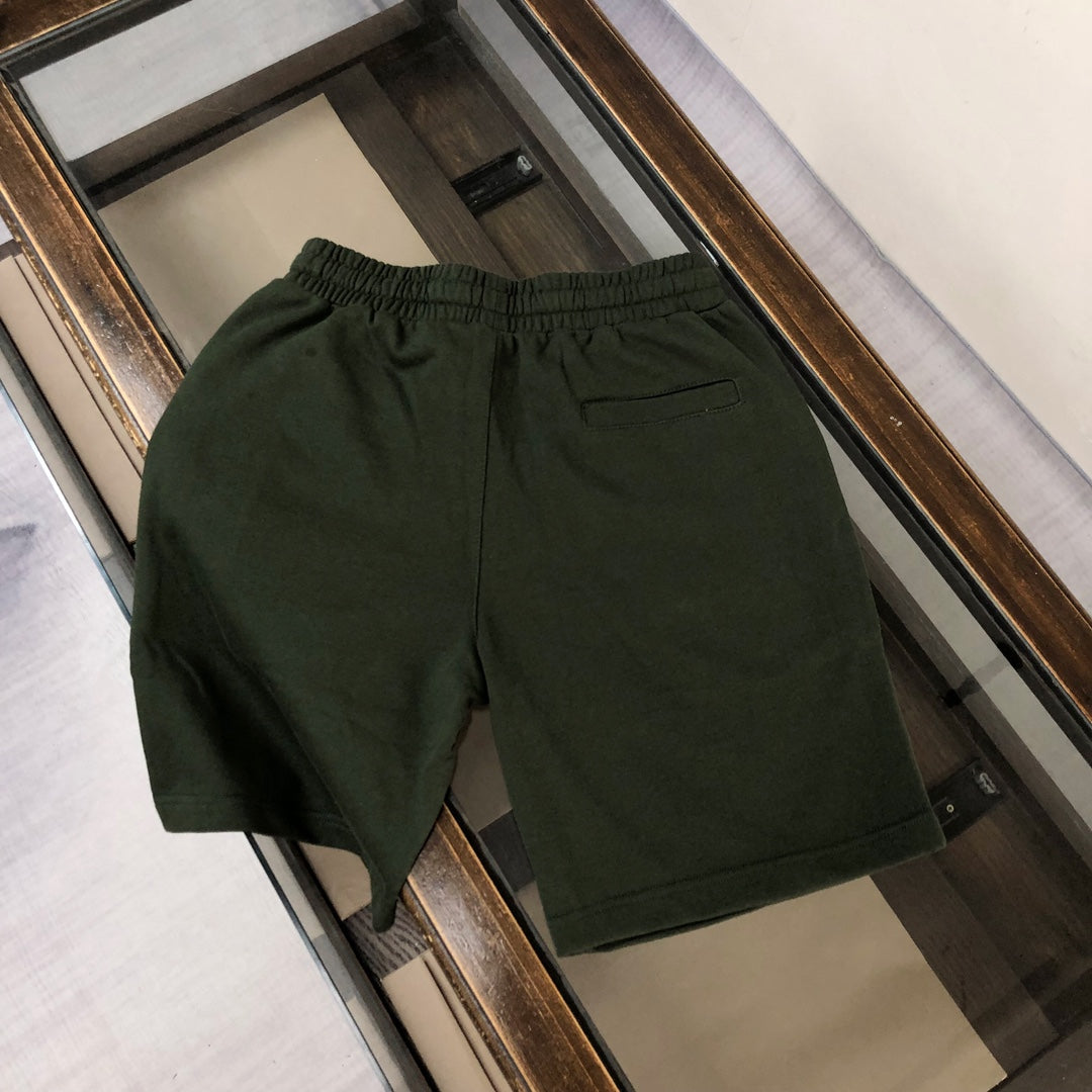 Dark green shorts with elastic waistband and side pockets