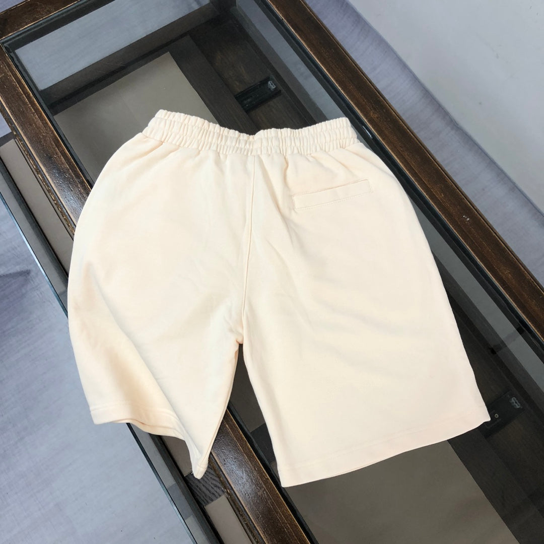 Cream shorts with elastic waistband and relaxed straight-leg silhouette