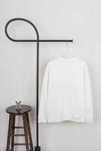 White long-sleeve sweatshirt with crew neck and plain back