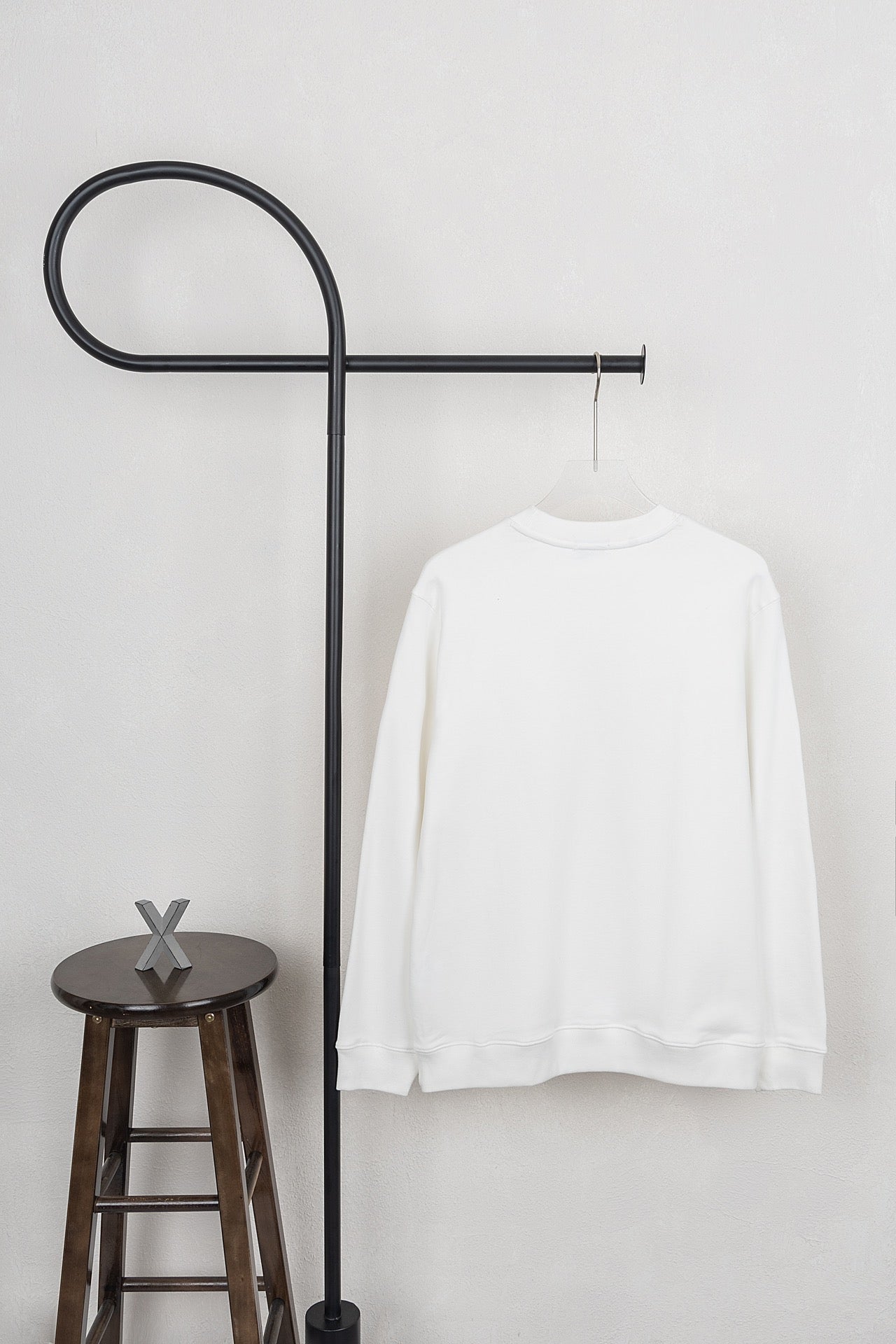 White long-sleeve sweatshirt with crew neck and plain back