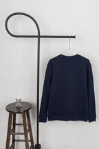 Moncler dark navy crewneck sweatshirt on hanger