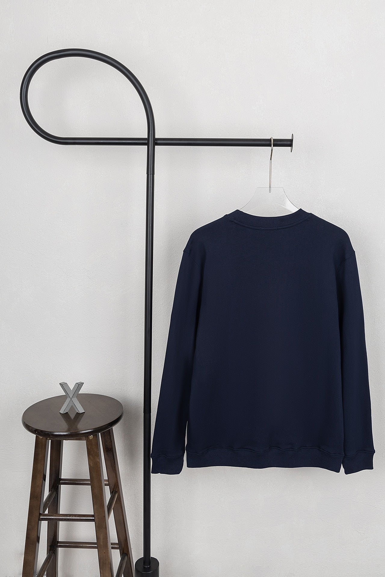 Moncler dark navy crewneck sweatshirt on hanger