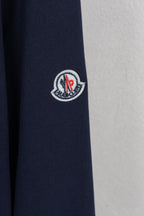 Moncler dark navy sleeve with circular crest patch