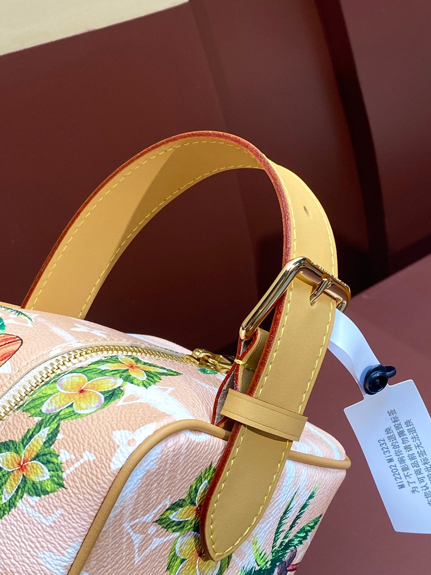 Louis Vuitton mini crossbody bag, yellow leather strap and gold-tone buckle hardware.