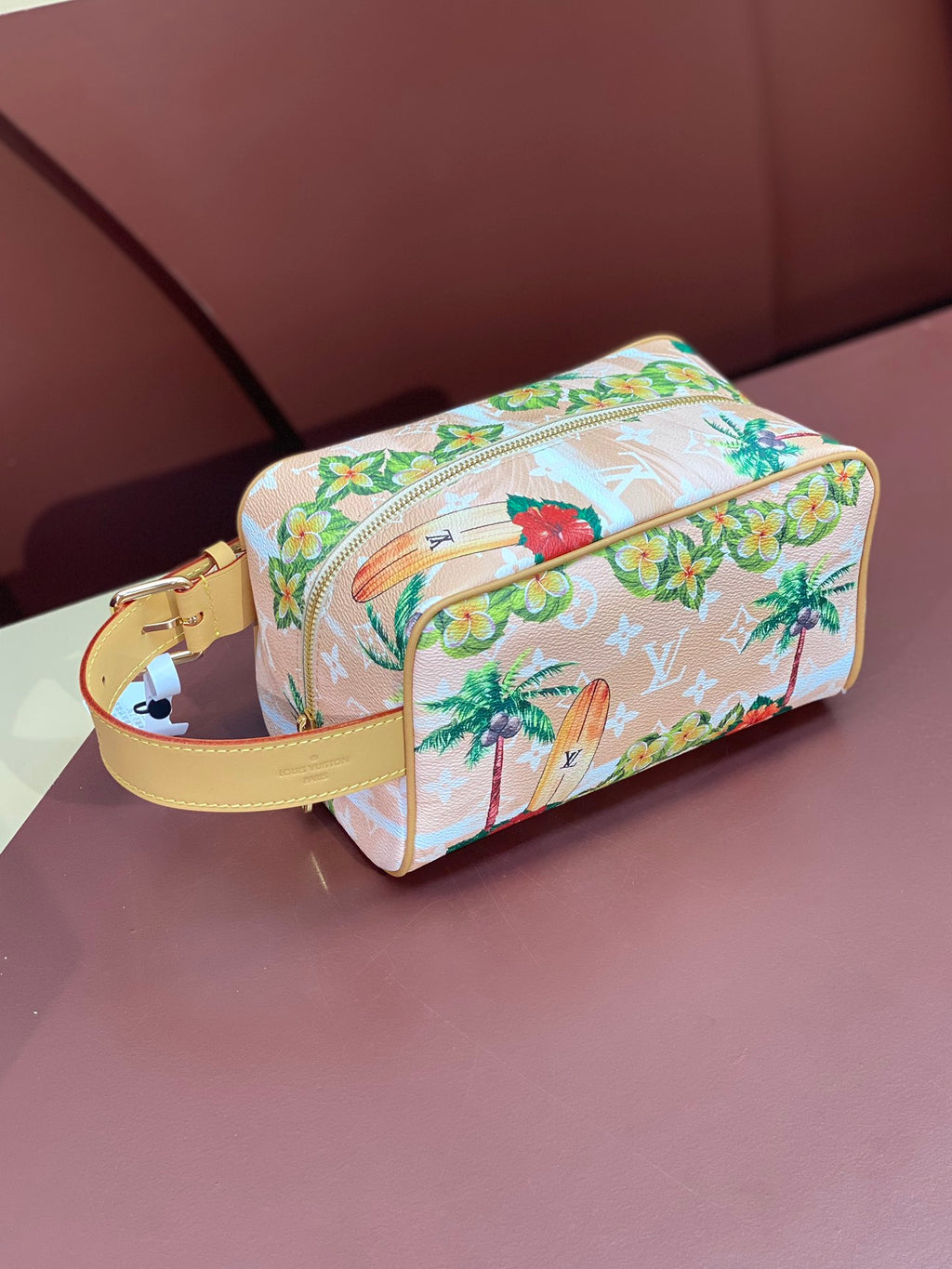 Louis Vuitton mini crossbody bag, floral toucan print, zip top, yellow strap.