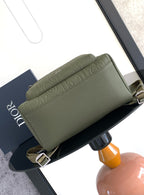 Olive-green Dior mini bag with embossed logo and adjustable crossbody strap