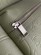 Olive leather zipper with silver pull and Dior logo charm tag