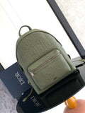 Olive green embossed leather backpack with top handle and front logo panel