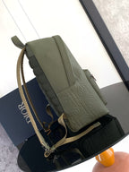 Olive-green Dior mini backpack with adjustable shoulder straps and front flap