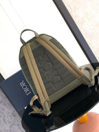 Olive-green Dior mini backpack rear view with two adjustable straps