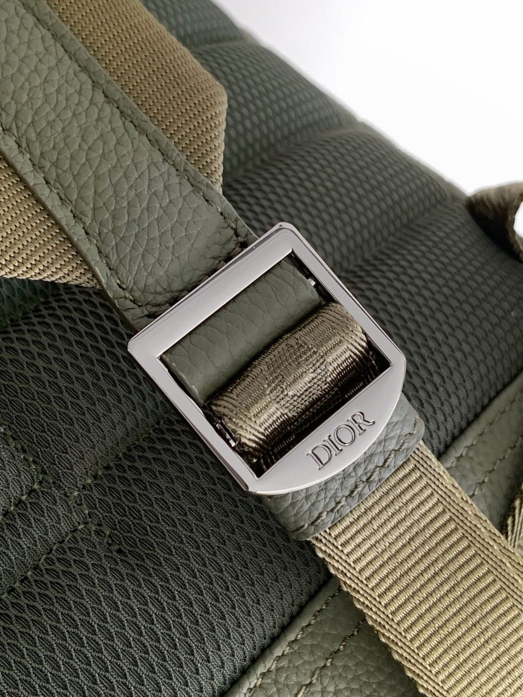 Olive bag strap with silver buckle and Dior logo nameplate
