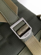 Olive bag strap with silver buckle and Dior logo nameplate