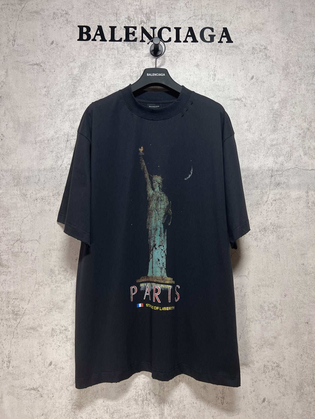 Dark graphic T-shirt with Statue of Liberty and “PARIS” print on the front