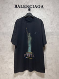 Dark graphic T-shirt with Statue of Liberty and “PARIS” print on the front