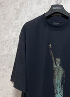 Dark short-sleeve T-shirt with large Statue of Liberty graphic at the chest
