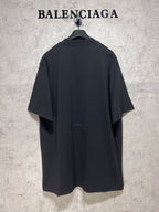 Dark back view T-shirt on a hanger with small Balenciaga logo near the center