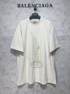 White short-sleeve T-shirt with Statue of Liberty graphic and PARIS print on front