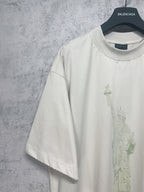 White short-sleeve T-shirt with partial Statue of Liberty print on front panel